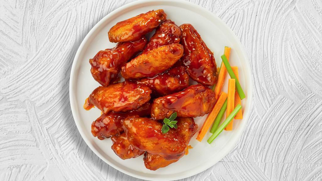 Bold Buffalo Wings · Fresh chicken wings breaded, fried until golden brown, and tossed in buffalo sauce. Served with a side of ranch or bleu cheese.