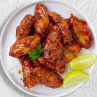 Oh Honey Bbq Wings · Fresh chicken wings breaded, fried until golden brown, and tossed in honey and barbecue sauc...