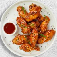 Mango Habanero Wings · Fresh chicken wings breaded, fried until golden brown, and tossed in mango habanero sauce. S...