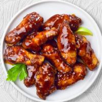Roadhouse Bbq Wings · Fresh chicken wings breaded, fried until golden brown, and tossed in barbecue sauce. Served ...