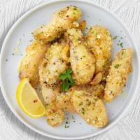 Poultry Parm Wings · Fresh chicken wings breaded, fried until golden brown, and tossed in garlic and parmesan. Se...