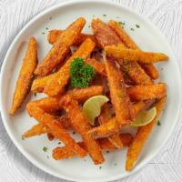 Sweet Potato Fries · (Vegetarian) Thick-cut sweet potato wedges fried until golden brown