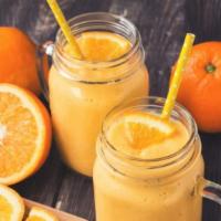 Orange Smoothie · Fresh mango, coconut, strawberries blended with skim milk and freshly squeezed orange juice.
