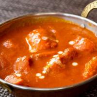 Chicken Tikka Masala · Tandoori cooked chicken cubes finished with a rich tomato based gravy.