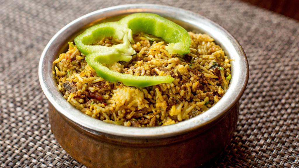 Vegetable Biryani · Basmati rice cooked with fresh mixed vegetable cumin seeds, curry leaves, mustard seeds and exotic herbs. Served with raita.