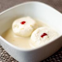 Rasmalai · Homemade spongy cheese patties dipped in cardamom flavored milk.
