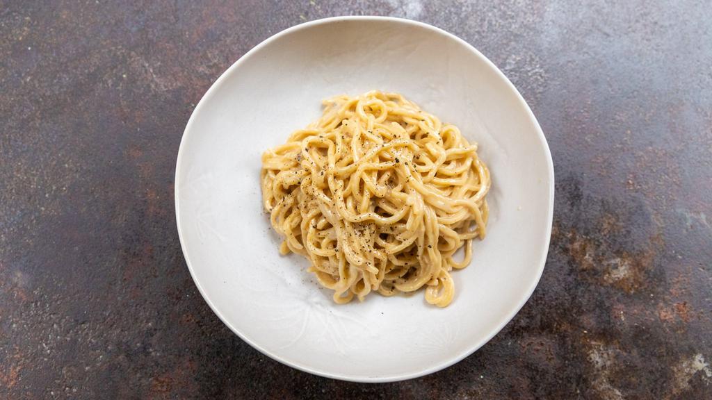 Spaghetti Cacio E Pepe · fresh tagliarini, pecorino, parmigiano-reggiano, crushed black pepper.
