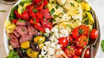 Antipasto Salad · Choice of greens, salami, ham, marinated olives, artichokes, tomatoes, and mozzarella, tosse...