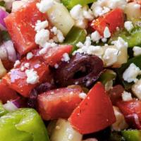 Greek Salad · Mixed greens with red onions, tomatoes, black olives, and feta cheese