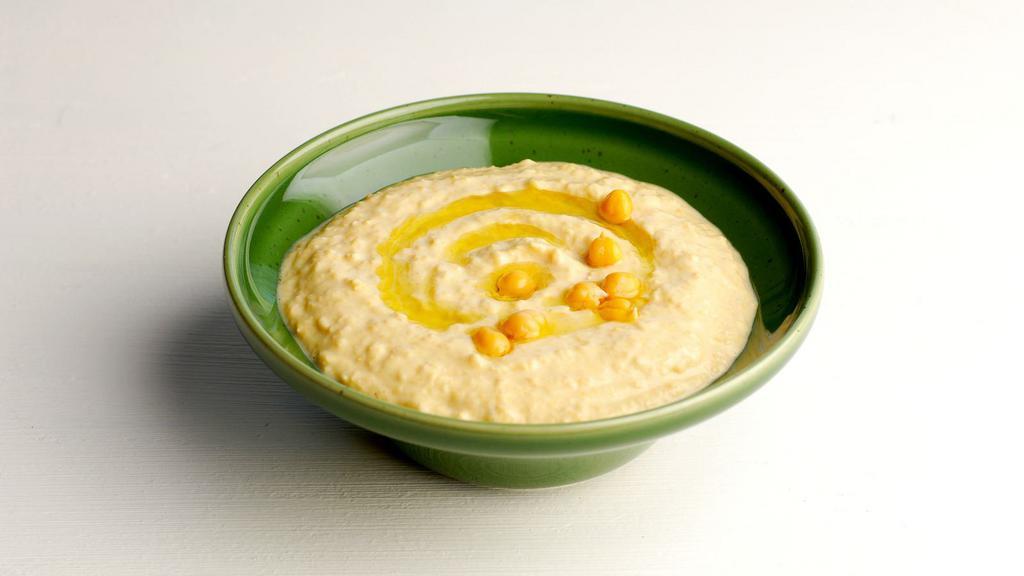 Hummus And Pita · Our homemade chick peas made with tahini sauce and ton of flavors.