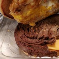 Steak Eggs & Cheese · A piece of grilled steak grilled with eggs and cheese on kiser roll.