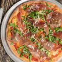 Prosciutto Pizza · Tomato sauce, fresh mozzarella, arugula, prosciutto di Parma and shaved parmigiano.
