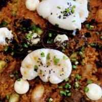 Paella Campera · Bomba rice, trumpet mushrooms, chicken, Mediterranean herbs, aioli, poached eggs.