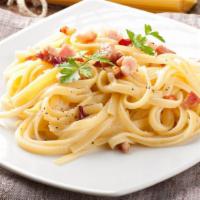 Spaghetti Carbonara · Pan fried pancetta, peas, and shallots in a cream sauce.