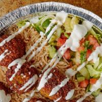 Falafel · Served with Basmati Rice and salad along with Hot and White sauce.