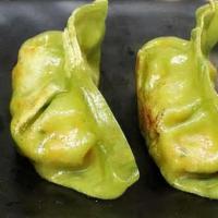 Fried Veg Dumpling · 6pcs. pan fried dumpling, made w. cabbage, green peas, carrots,edamame. served w. dumpling s...