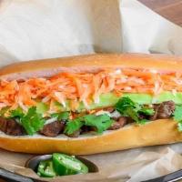 Grilled Pork Sandwich · Grilled pork with mayo, butter, cucumber, cilantro, julienne carrots and daikon radish ,serv...