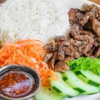 Grilled Pork Rice · lemongrass BBQ pork. With your choice of white rice or brown rice. come with cucumber ,green...