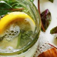 Basil Ginger Lemonade · simple syrup, lime, lemon, basil, candied ginger & toped w. spakling water