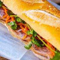 Banh Mi Pate · Toasted baguette with pate, Vietnamese hams, pickled carrot and daikon, cilantro, and season...