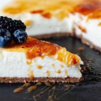 Creme Brulee Cheesecake Slice With Whip Cream · Calling all cheesecake fans! This creme brulee cheesecake is super creamy, super thick and s...
