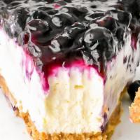 Blueberry Cheesecake Slice With Whip Cream · Smooth and delicious cheesecake with full of berrylicious sweets! Blueberry topping has been...