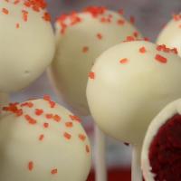 Organic Red Velvet Cake Pop · Smooth red velvet cake mixed with cream cheese and dipped in white chocolate only for you!
