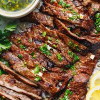 Grilled Skirt Steak · With sautéed serrano peppers, onions, and mushrooms.