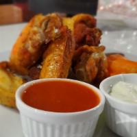 Chicken Wings · Choice of BBQ or buffalo. Blue cheese dressing carrots, celery.