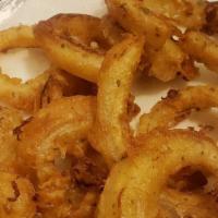 Modelo Onion Rings · Modelo negra beer batter onion rings.