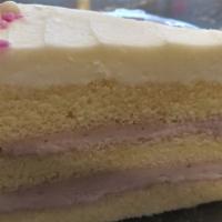 White Raspberry Torte · Cheesy Eddie's famous white chiffon cake layered with raspberry mousse filling and frosted w...