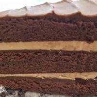 Very Chocolate Cake With Ganache · Cheesy Eddie's famous dark chocolate cake layered with light chocolate buttercream filling a...