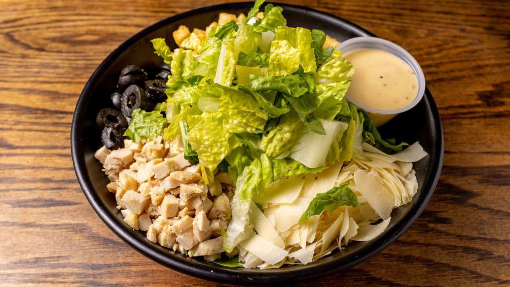 Classic Caesar Salad · Romaine, Parmesan cheese, and croutons and Caesar dressing.
