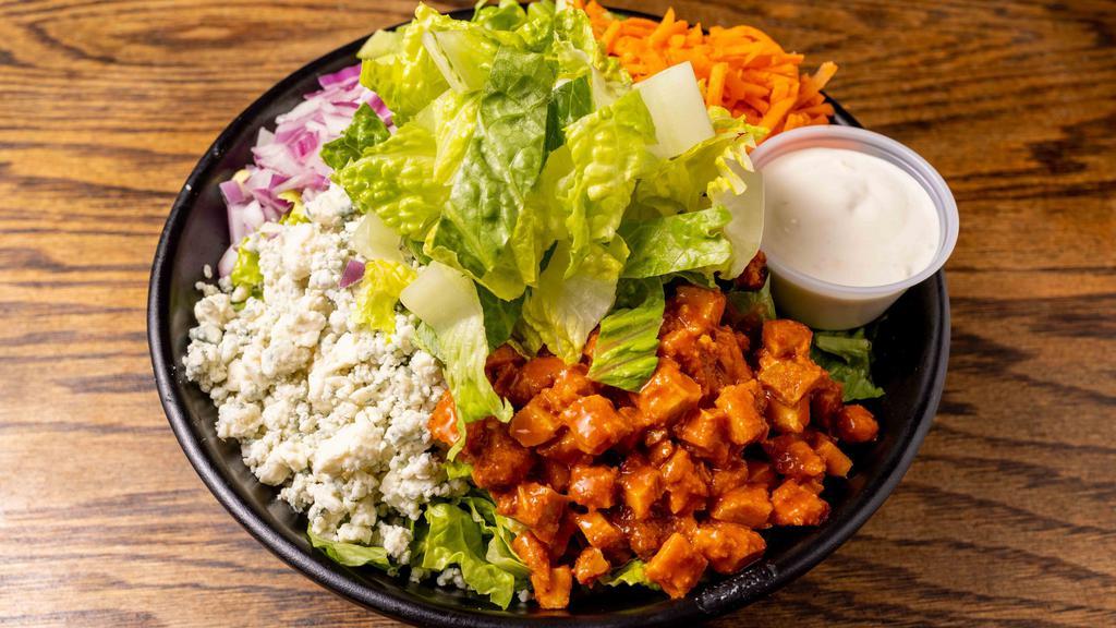 Buffalo Salad · Romaine, Crispy buffalo chicken, red onions, shredded carrots, celery, and blue cheese with Blue cheese dressing.