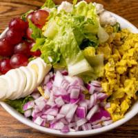 The Paul Salad · Romaine, curry chicken, feta cheese, egg, craisins, and red onion-without dressing.