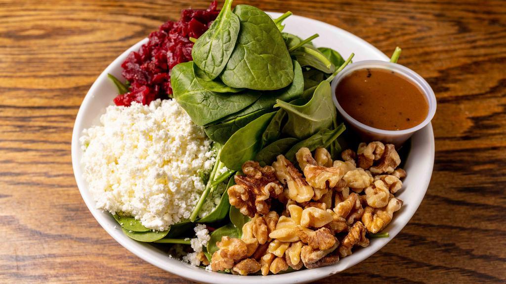 Red & White Salad · Baby Spinach, beets, walnuts, and goat cheese with Balsamic Vinaigrette Dressing.
