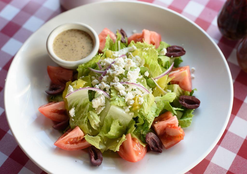 Greek Salad · Romaine lettuce, kalamata olives, pepperoncini, tomatoes, red onion, feta cheese with mediterranean red wine vinaigrette dressing.