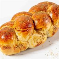 Zaatar Challah · Fluffy challah with Zaatar spice topping.

Order by Thursday night for Friday delivery/picku...