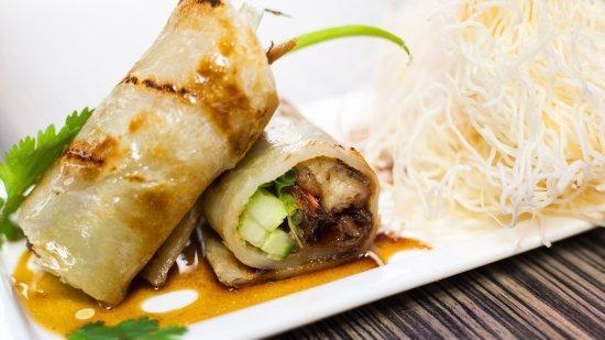 Roast Duck Roll App · (10 pcs) roast duck meat, scallion and cucumber wrap with crispy pancake in special duck sauce.