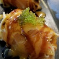 Thunder Salmon · Eel, kani, crunch wrapped by salmon with wasabi tobiko.