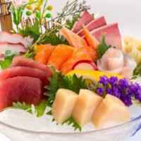 Sashimi Deluxe · 20 pieces of sashimi. Served with miso soup or salad.