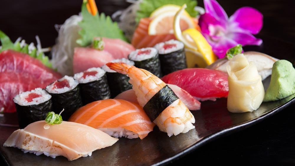 Sushi And Sashimi Combination · 5 pieces of sushi, 12 pieces of sashimi and 1 california roll. Served with miso soup or salad.