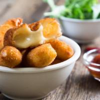 Mozzarella Sticks · Melted mozzarella cheese battered and fried to perfection. Served with Marinara parmesan sau...