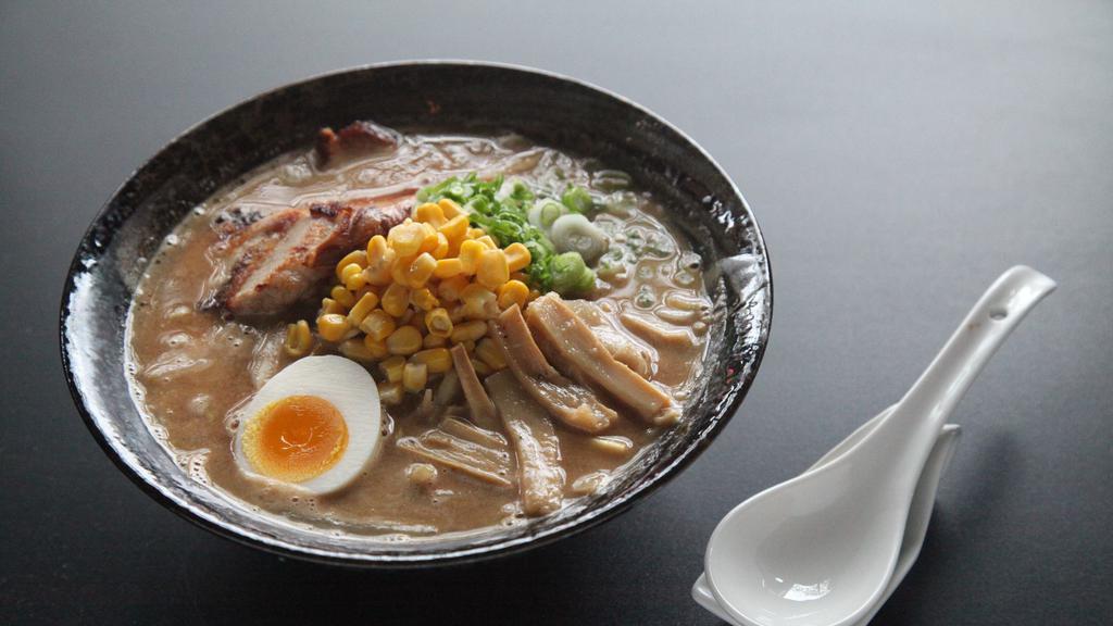 Miso Ramen · Noodle soup with miso made with more than 12 ingredients, fermented for a month. Topped with chasyu (pork), menma, egg, scallion, bean sprouts, cabbage, and corn.