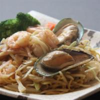 Seafood Yaki Ramen · Spicy pan-fried seafood noodles with our homemade soy sauce and vegetables. Topped with shri...