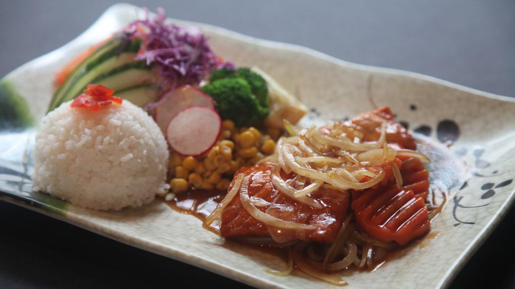 Salmon Teriyaki · Pan-fried salmon with teriyaki sauce, served with rice, cabbage, corn, broccoli, and oshinko.