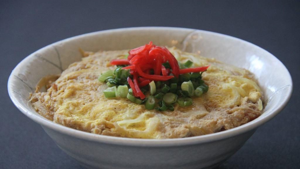 Katsu Don · Rice bowl topped with simmered chicken or pork cutlet, egg and onion. Topped with scallion and ginger.