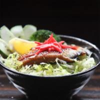 Unagi Don · BBQ eel over rice. Topped with broccoli, cucumber, cabbage, and ginger.