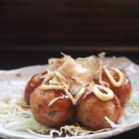 Takoyaki · Ball-shaped Japanese snack made with a wheat flour-based batter and filled with minced octop...