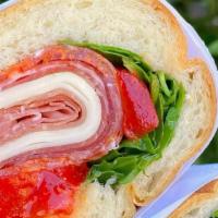 Padrino · Prosciutto, sopressata, capocollo, provolone, arugula, and vinaigrette.